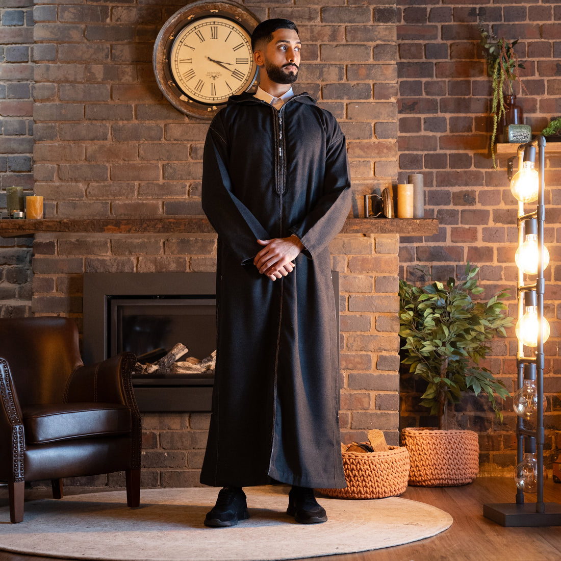 Charcoal Grey Luxe Moroccan Thobe by the fireplace